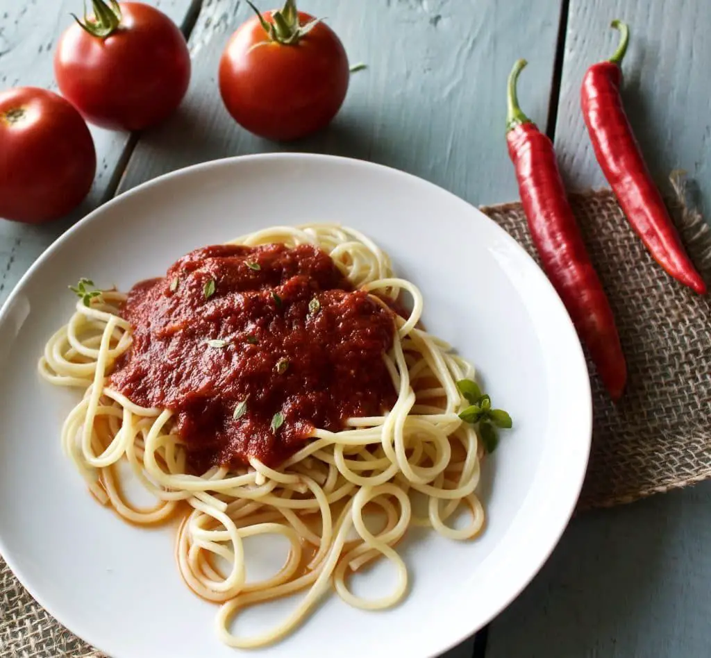 Easy marinara sauce over pasta by homemadefoodjunkie.com