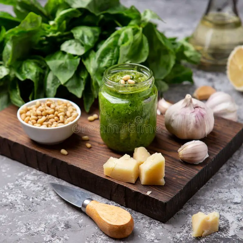 Pesto Sauce in a Bottle with Ingredients Stock Image