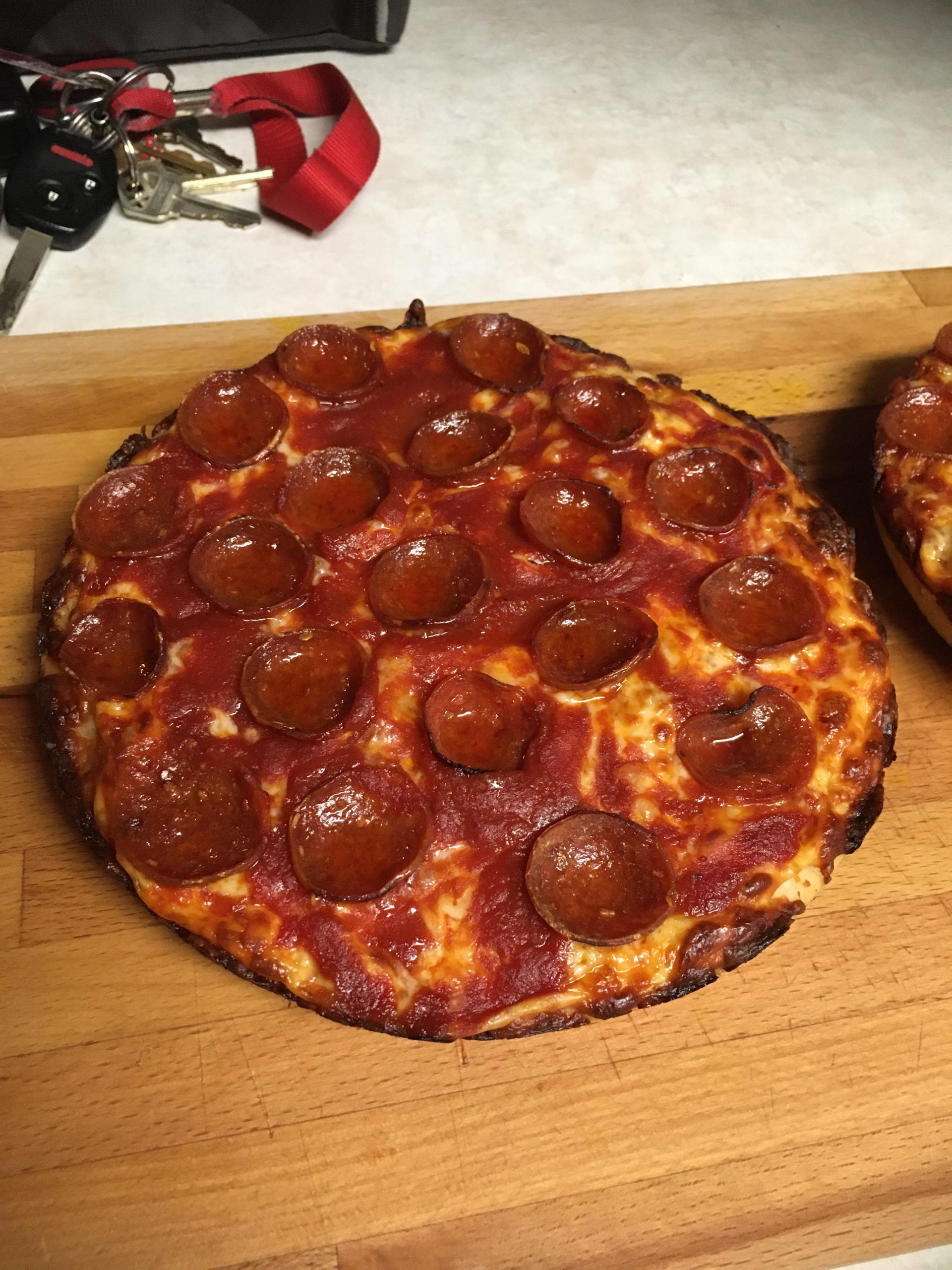 Sauce on top of cheese : Pizza